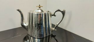 A Victorian Silver Plated Tea Pot With Engraved Patterns.  Late 1800.  S.  Ornate.