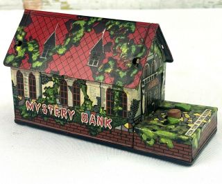 1950 Nomura Toys Japan Mechanical Mystery Bank Tin Haunted House Coin Grabber