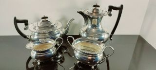 An Antique Victorian Style 4 Piece Silver Plated Tea Set With Elegant Patterns.