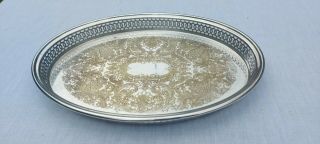 A Vintage Silver Plated Oval Gallery Serving Tray With Engraved Patterns.