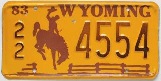 Vintage Orange Wyoming 1983 License Plate,  22 4554,  Cowboy,  Bucking Horse