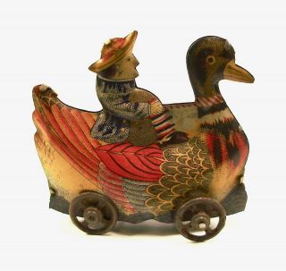 Pre War Dutch Missionary Riding Mandarin Duck Japanese Tin Penny Toy NR 6