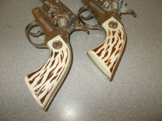 Cap gun toy pistol pair vintage antique diecast Hubley Marshal USA made 2