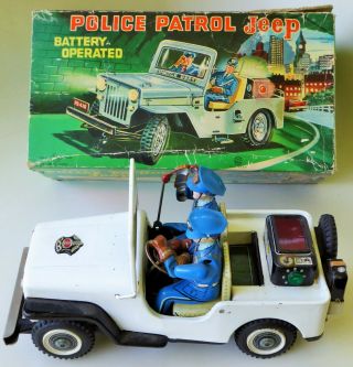 T.  N.  Nomura Japan Police Patrol Jeep Tin Lithographed Battery Operated Toy Box