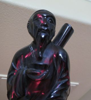 Old Chinese Dark Cherry Amber Bakelite Carved Figure Painter