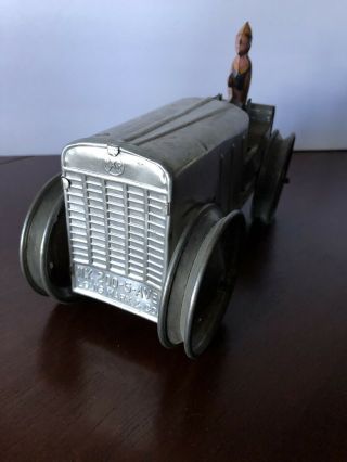 Louis Marx & Co.  Tin Toy Wind Up Tractor - Silver W/driver