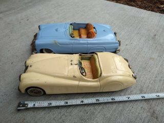 Two 1950s Tin Friction Toy Cars Jaguar & 50s Ford T - Bird Yonezawa Japan As - Is