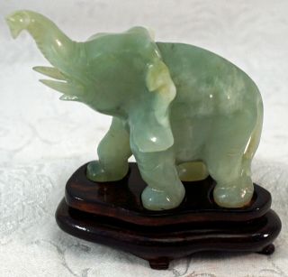 Jade Hardstone Carving Figurine Of An Elephant Raised Trunk On Fitted Wood Stand