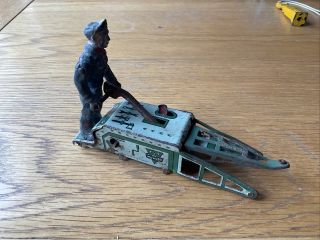 Very Interesting Early Arnold Of West Germany Tin Plate Toy.  Man On A Mower?