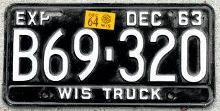 1963 White On Black Wisconsin Truck License Plate With A 1964 Sticker