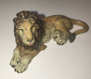 Vintage/antique Cast Iron Lion Figural Toy Hand Painted Marked 1” Tall 2.  25”long