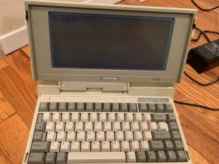 Vintage 1987 Toshiba T1200 Laptop Computer With A Charger And The Bag