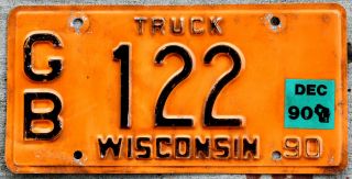 1990 Black On Orange Wisconsin Truck License Plate With A 1990 Sticker