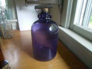 1909 Amethyst Purple Glass One Gallon Whiskey Jug With Handle & Cork Stopper