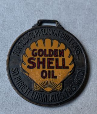 Vintage Golden Shell Oil Watch Fob - G.  H.  Woldum