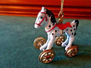 Vintage Miniature Dollhouse Painted Metal Horse On Wheels Ornament,  2 " L