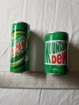 (2) Vintage Mountain Dew cans Dubai ? 3