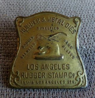 Antique Advertising Los Angeles Rubber Stamp Co.  Badges Etc.  Brass Paper Clip