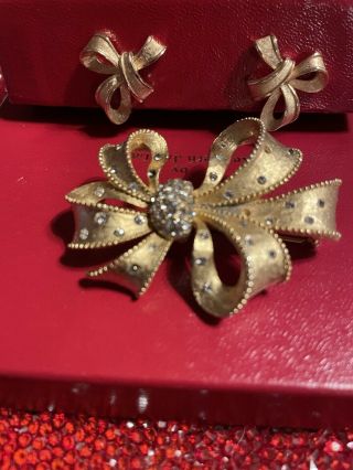 Festive Vintage Trifari Clip On Earrings And A Gold/crystal Bow Brooch .