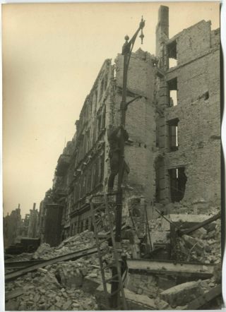 Wwii Press Photo: Ruined Berlin Street View Russian Soldier On Lamp Post May1945