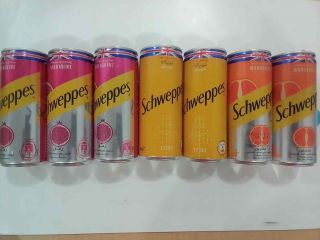 Seven Cans Of The International Schweppes Drink With Arabic Writing Empty In Exc