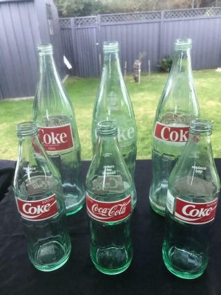 6 Vintage Green Glass Coca Cola (coke) Bottles Ceramic Lables 1970s 80s