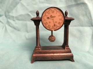 Vintage Miniature Die Cast Metal Pencil Sharpener Urgos Clock Mantle Pendulum