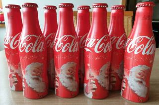 Coca Cola Alu Bottle From Benelux.  Christmas.  8 Empty Bottles