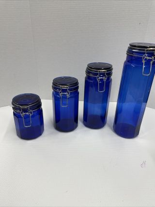 Vintage Set Of 4 Cobalt Blue Glass Canisters Hinged Lid & Wire Bail Clamps