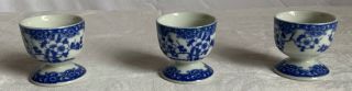 Set Of 3 Egg Cups Blue And White Porcelain.  Floral Designed.  2” Tall.