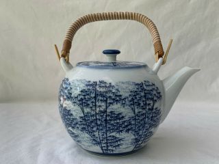 White Tea Pot With Rattan Handle And Blue Bamboo Forest Design