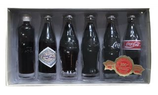 Coca Cola Miniature Evolution Of The Contour Bottles