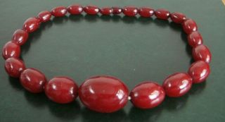 A String Of Bakelite Cherry Amber Beads 50 Grams