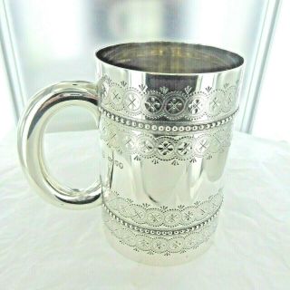 A Good Large Antique Sterling Silver Chased Mug.  London 1878
