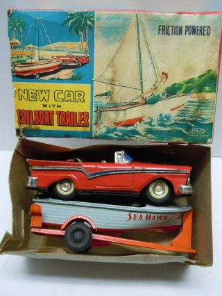 Vintage Japan Haji Tin Friction 1957 Ford Car W/ Sailboat & Trailer.