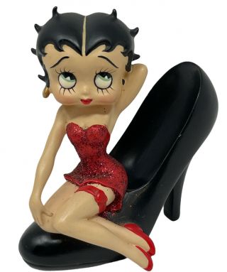 Vintage Betty Boop In A Red Glitter Dress Sitting On A Black Shoe Figurine
