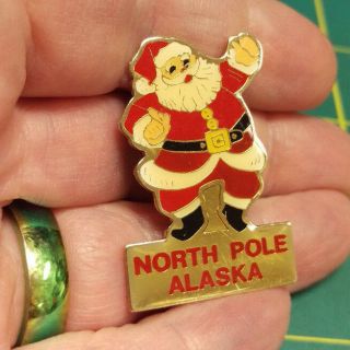 North Pole Alaska Santa Pin With Santa Claus On The Top And Wording On Bottom