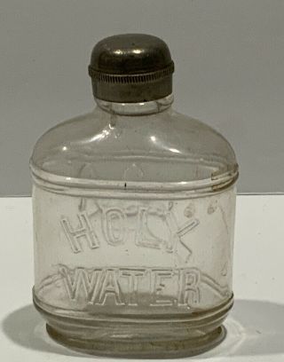 Antique Glass Holy Water Bottle Embossed Cross & Crown Screw On Top.  3 1/2”