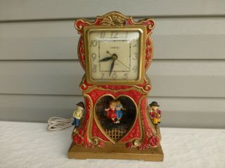 Vintage United Swinging Sweethearts Motion Electric Clock