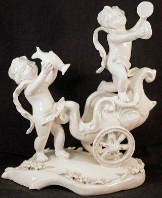 White Porcelain Capodimonte Nude Cherub Putti Figurine Dancing With Cart F.  W.  L.  M