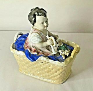 Antique Porcelain Figurine Baby Girl In Laundry Basket With Toys Box