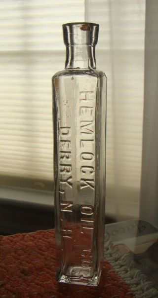 Antique Hemlock Oil Co.  - Derry,  N.  H.  Four Sided Medicine Bottle - 1880 