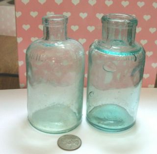 Two Vintage Aqua Bottle Embossed,  Davis Ok Baking Powder