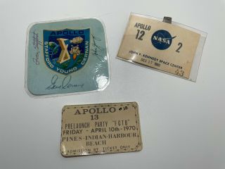 Apollo X Autographed Sticker,  Apollo 12 Badge,  Apollo 13 Pre Launch Ticket