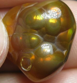 11.  1 Ct. ,  16x16x7mm Polished Fire Agate