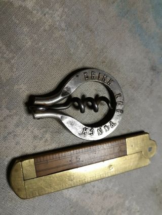Antique Folding Bow Corkscrew With Advertising For Taylor Whiskies & Hub Punch