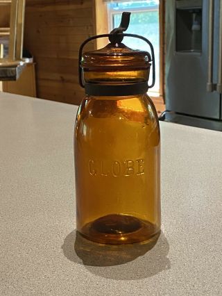 Antique 1886 Patent Globe Fruit Mason Jar With Lid And Bail Amber Quart