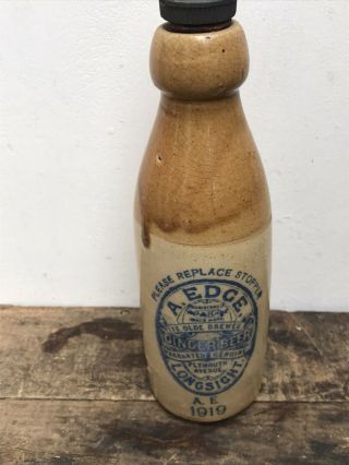 1919 A.  Edge Longsight Blue Print Stoneware Ginger Beer Bottle