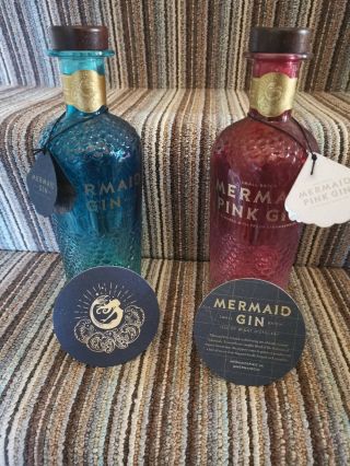 2x (pink,  Blue) Isle Of Wight Mermaid Gin Bottles — Empty With Tags,  Mats,  Caps